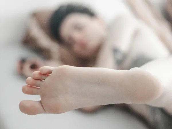 Bare foot of a person lying down